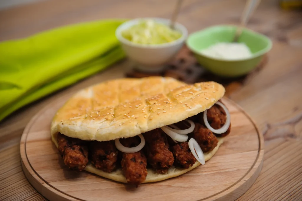 Traditional Balkan cevapi with lepinja bread